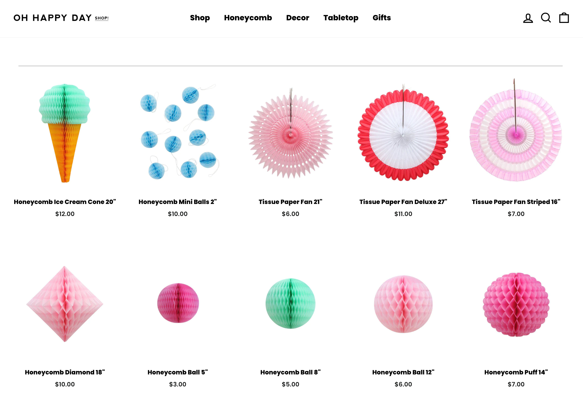 Screenshot from the Oh Happy Day store showcasing its Honeycomb collection, featuring decor made from honeycomb tissue paper.