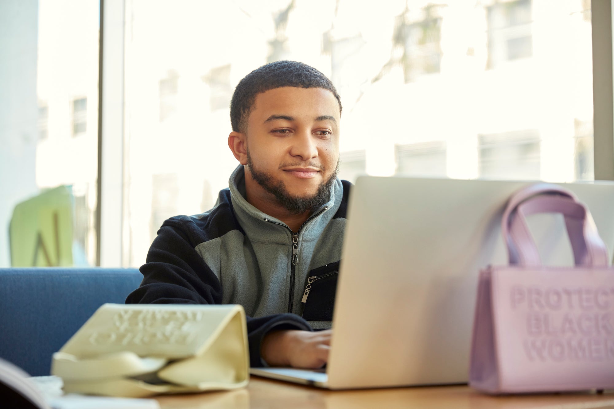 CISE founder Blake Van Putten following his Shopify Fulfillment Network deliveries on a laptop.