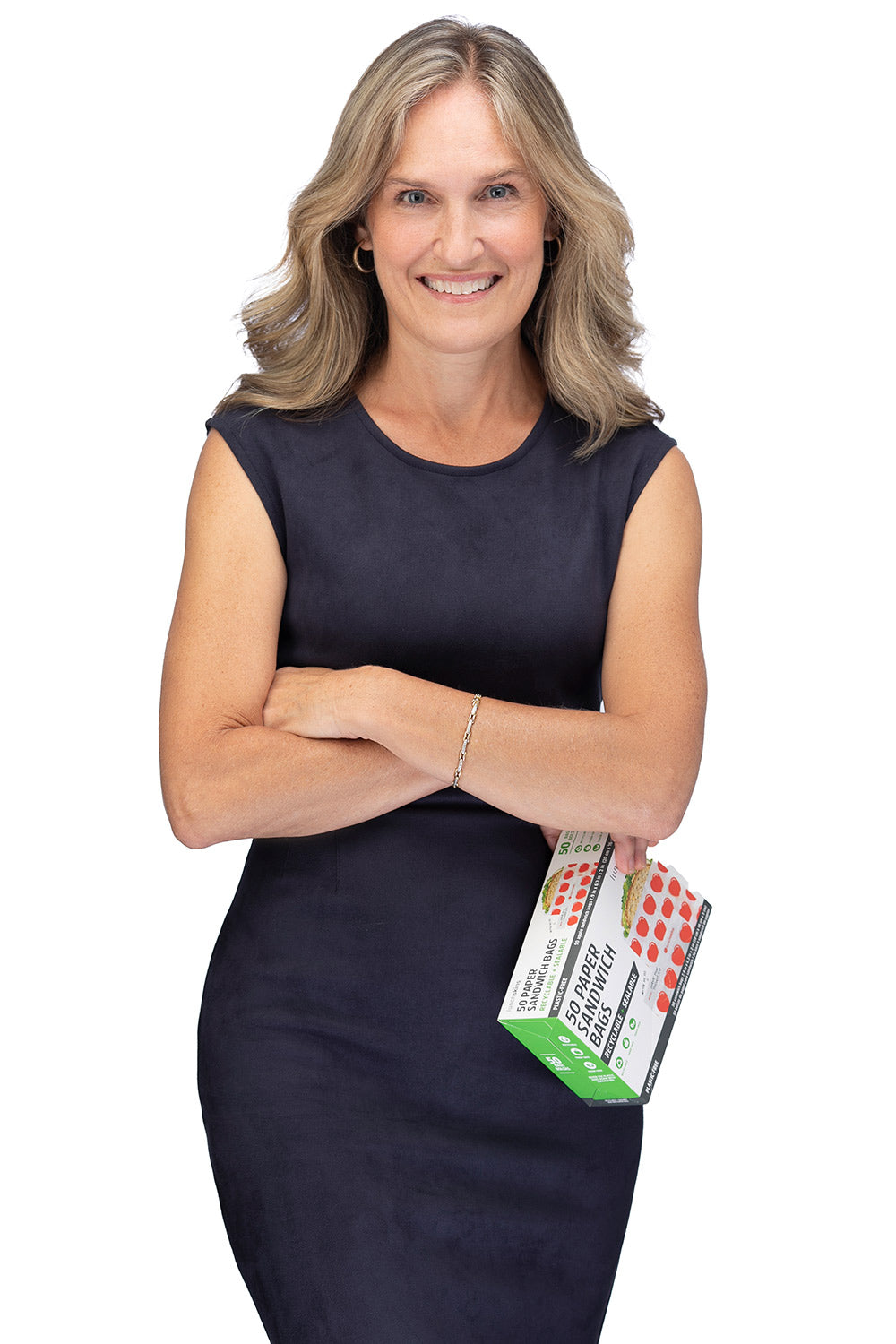 Lunchskins founder Kirsten Quigly holding a box of 50 paper sandwich bags.