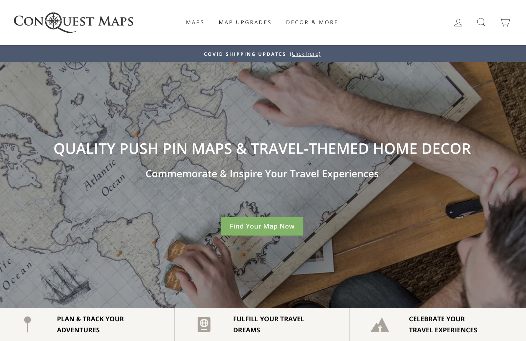 Conquest Maps homepage with a person pointing at a large paper map