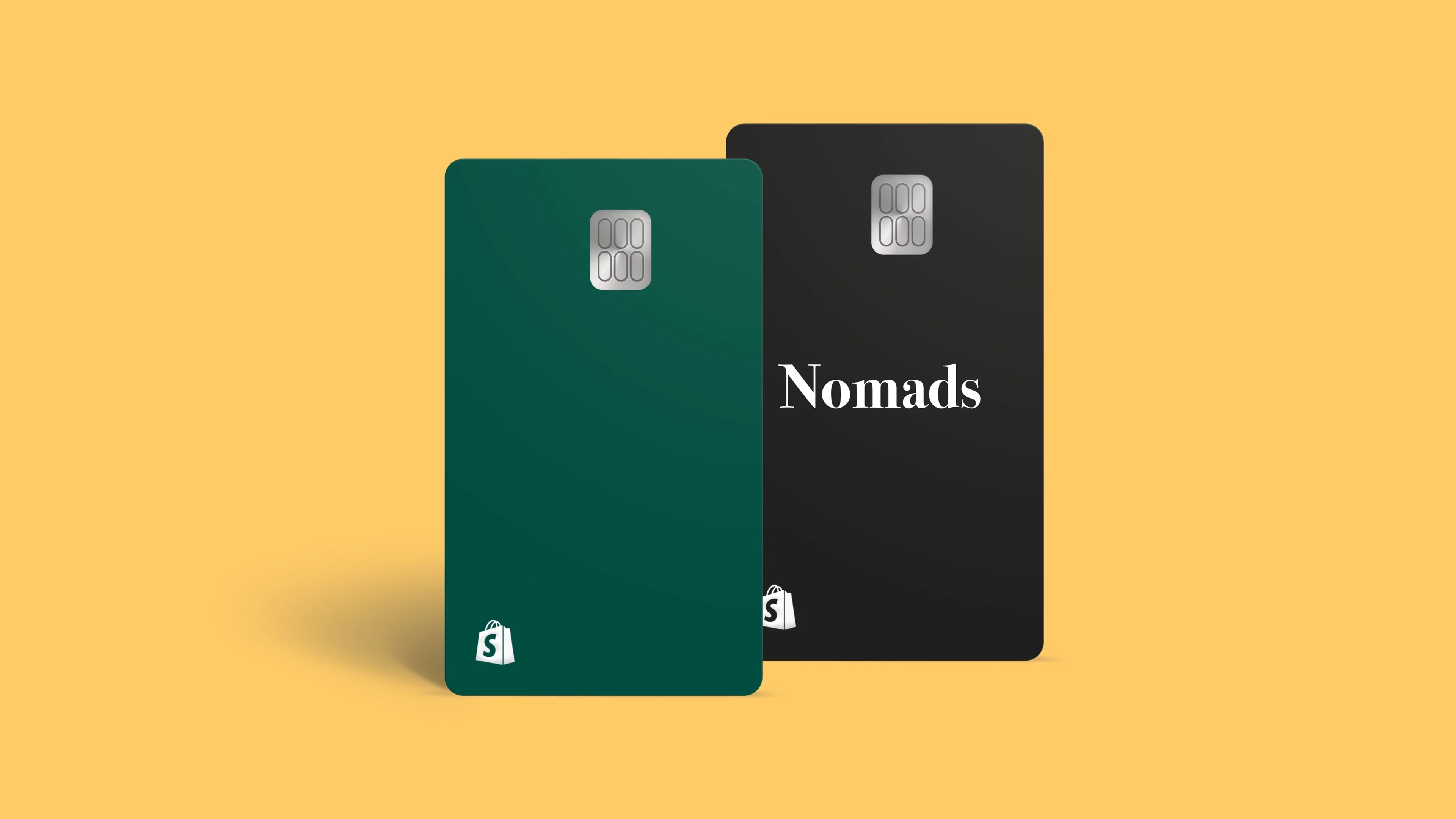 Plain yellow backdrop and two bank cards with chip and pin technology. Both feature a shopify logo and one reads