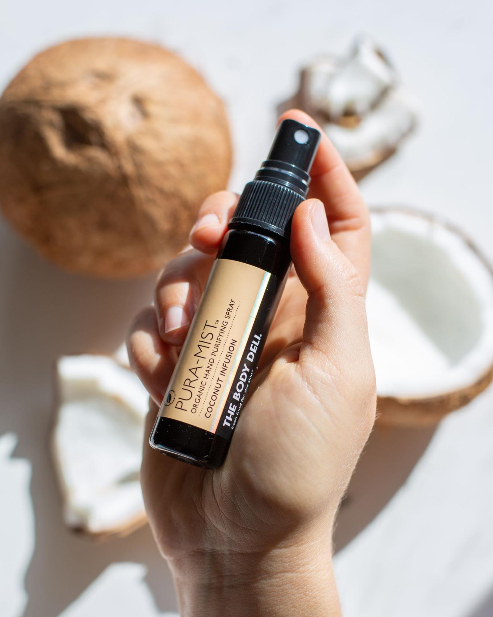 image of a hand holding the Pure-A-Mist spray